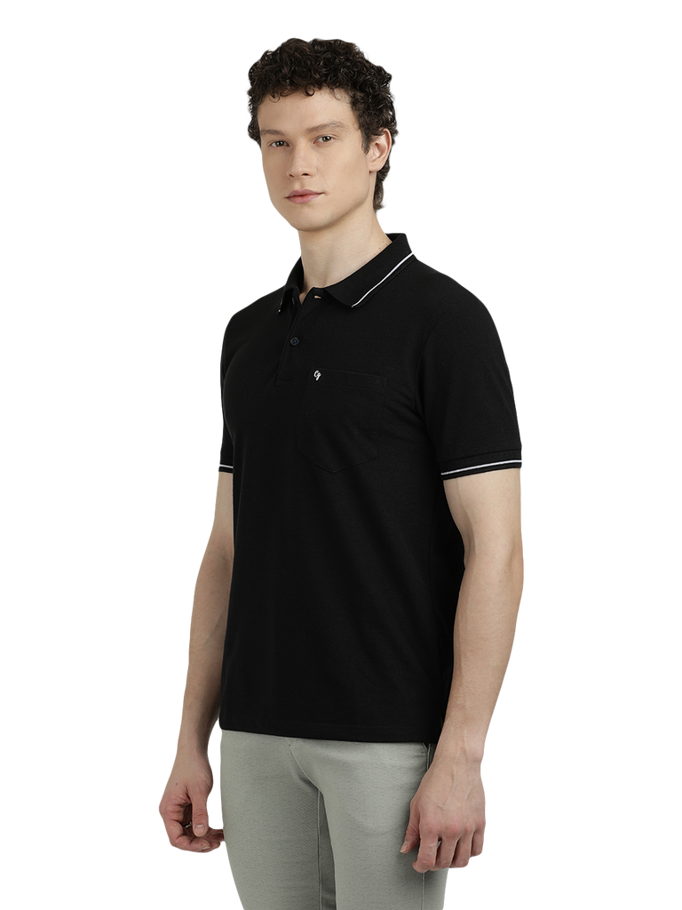 Model wearing Clarke Gable's Dark Black Solid Polo Collar T-Shirt in a casual setting