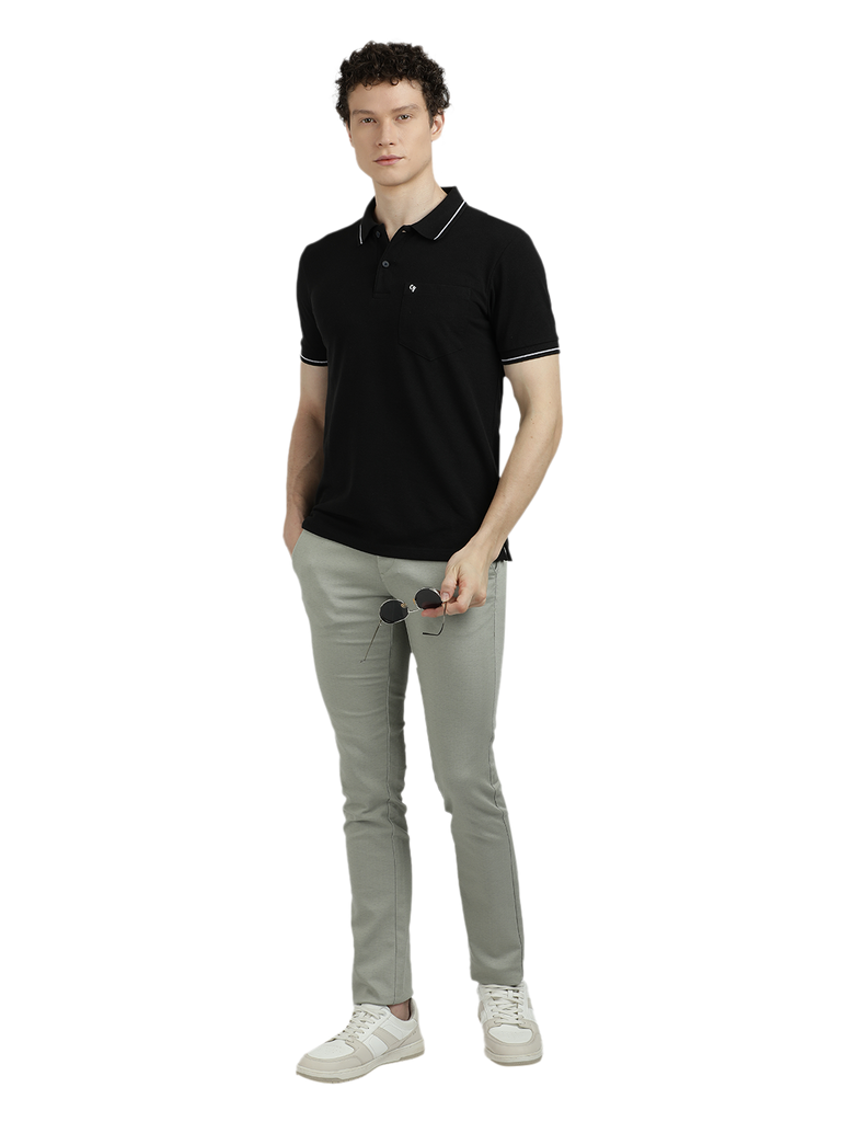 Model wearing Clarke Gable's Dark Black Solid Polo Collar T-Shirt in a casual setting