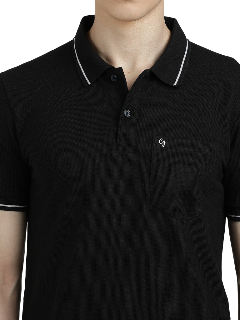 Model wearing Clarke Gable's Dark Black Solid Polo Collar T-Shirt in a casual setting