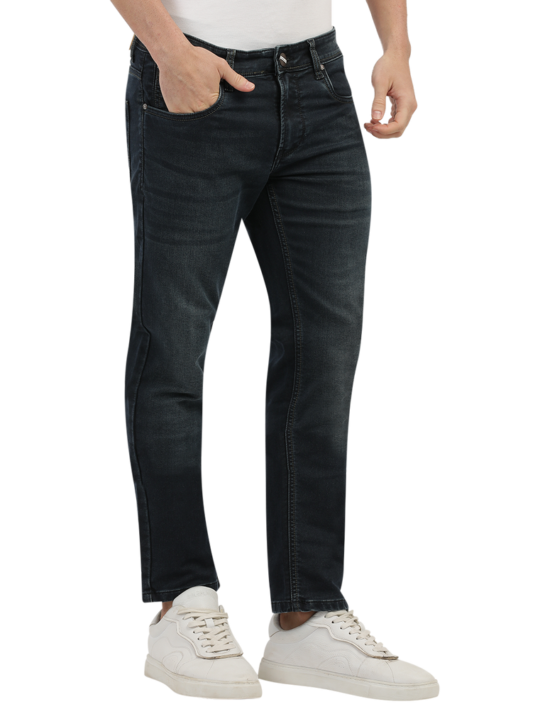 Model wearing Clarke Gable's Dark Blue Tinted Skinny Fit Jeans in a casual setting