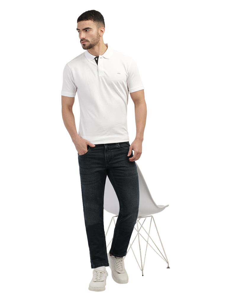 Model wearing Clarke Gable's Dark Blue Tinted Skinny Fit Jeans in a casual setting