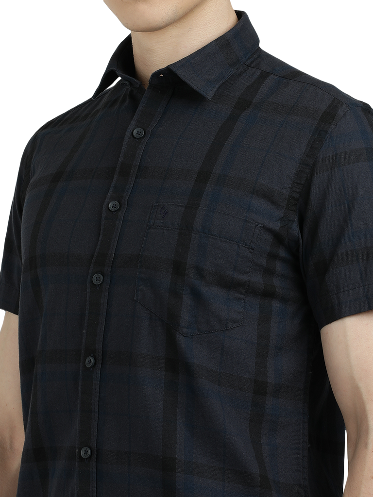 Model wearing Clarke Gable's Dark Grey Checked Semi Casual Shirt in a casual setting