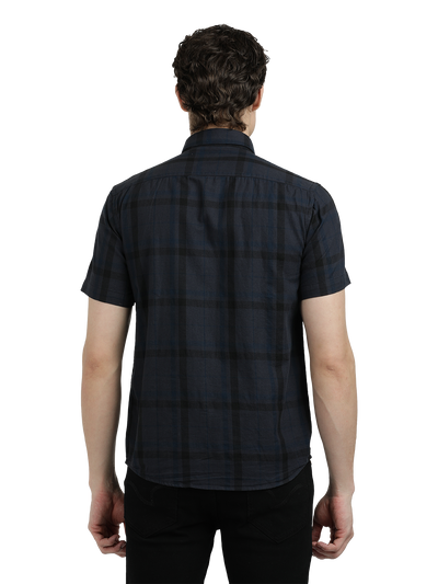 Model wearing Clarke Gable's Dark Grey Checked Semi Casual Shirt in a casual setting