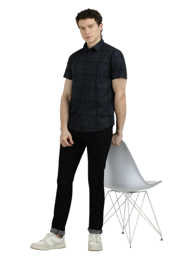 Model wearing Clarke Gable's Dark Grey Checked Semi Casual Shirt in a casual setting