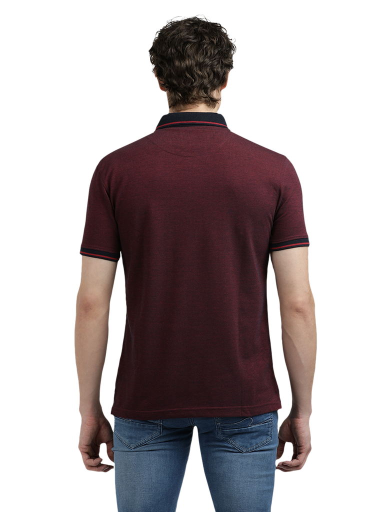 Model wearing Clarke Gable's Dark Maroon Solid Polo Collar T-Shirt in a casual setting