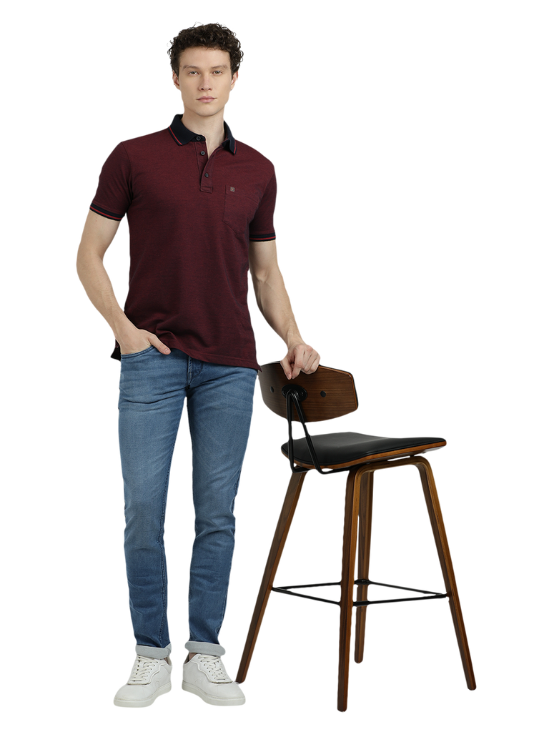 Model wearing Clarke Gable's Dark Maroon Solid Polo Collar T-Shirt in a casual setting