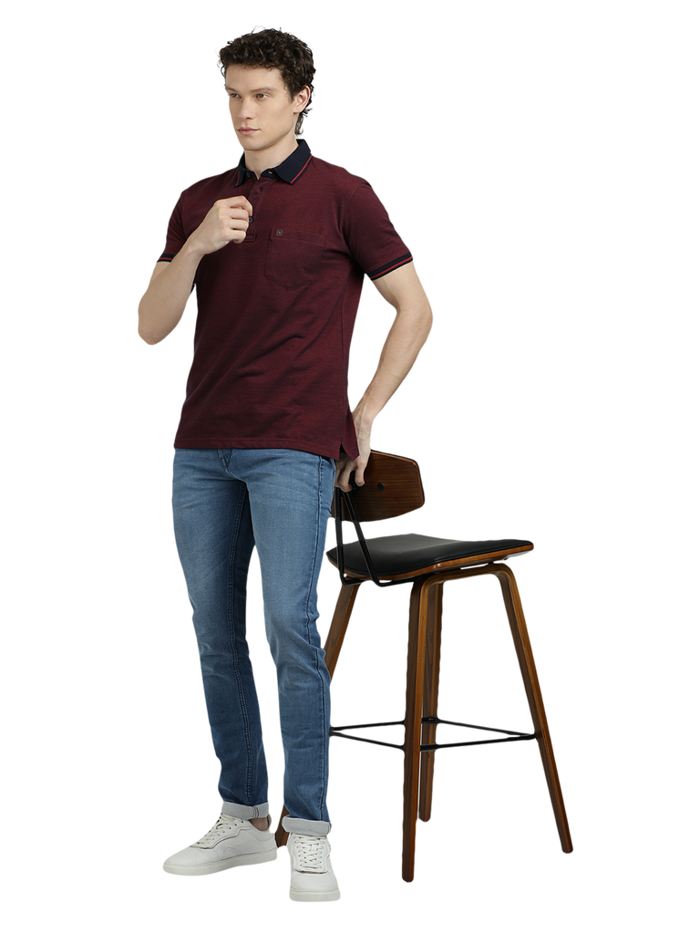 Model wearing Clarke Gable's Dark Maroon Solid Polo Collar T-Shirt in a casual setting