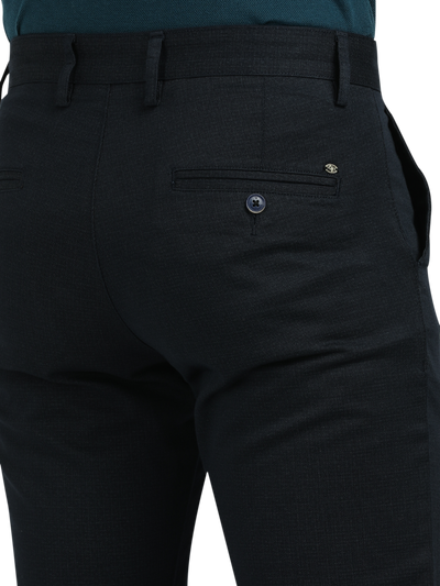 Model wearing Clarke Gable's Dark Navy Custom Fit Trousers in a casual setting