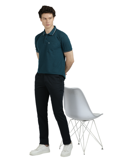 Model wearing Clarke Gable's Dark Navy Custom Fit Trousers in a casual setting