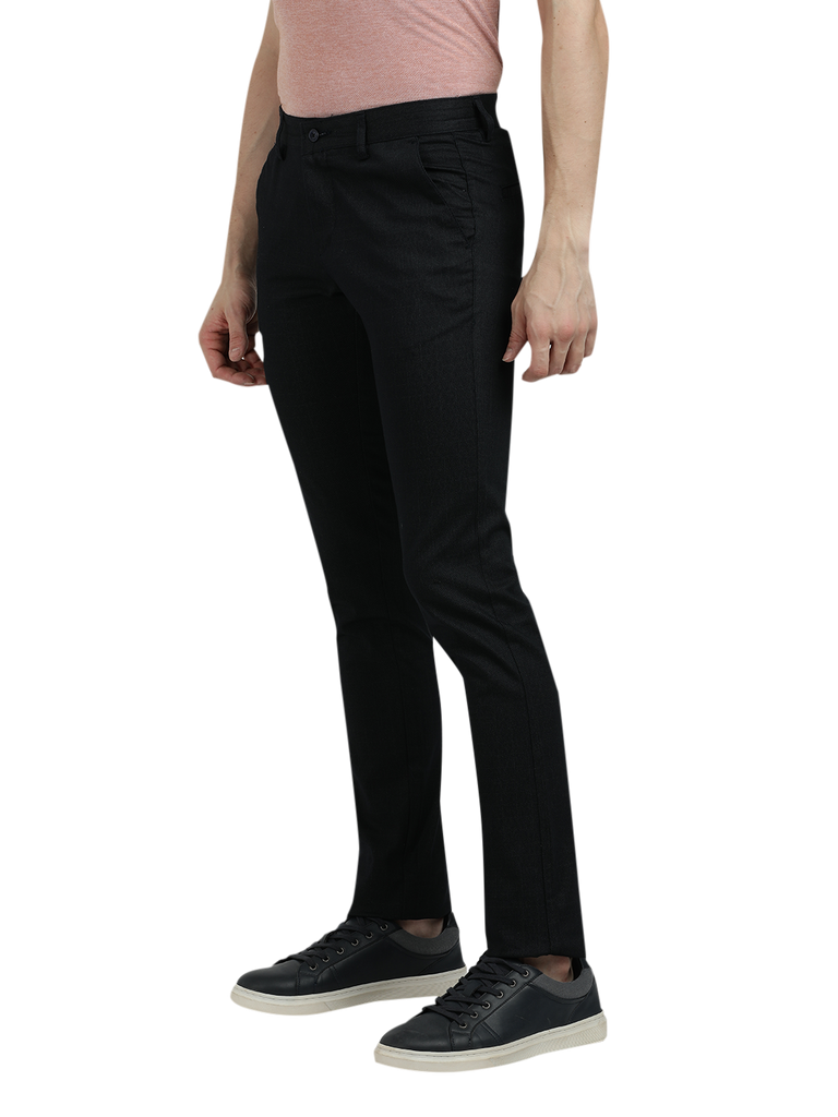 Model wearing Clarke Gable's Dark Navy Trim Fit Trousers in a casual setting