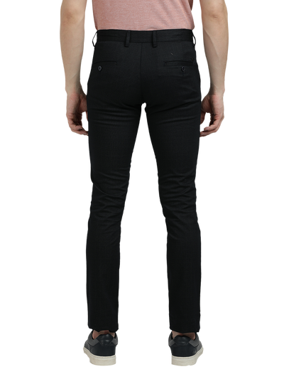 Model wearing Clarke Gable's Dark Navy Trim Fit Trousers in a casual setting