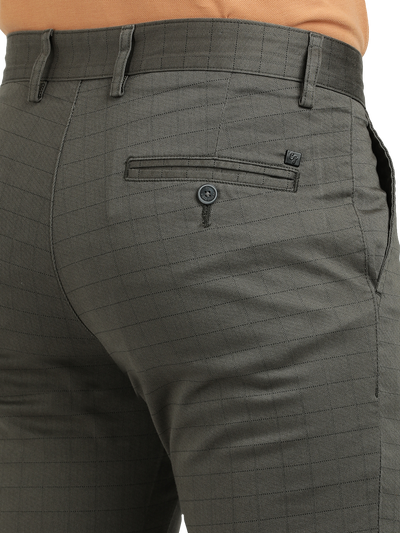 Model wearing Clarke Gable's Dark Olive Custom Fit Trousers in a casual setting