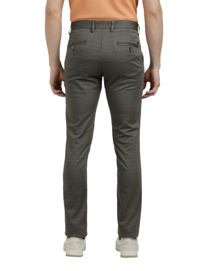 Model wearing Clarke Gable's Dark Olive Custom Fit Trousers in a casual setting