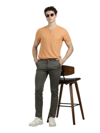 Model wearing Clarke Gable's Dark Olive Custom Fit Trousers in a casual setting