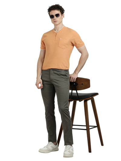 Model wearing Clarke Gable's Dark Olive Custom Fit Trousers in a casual setting