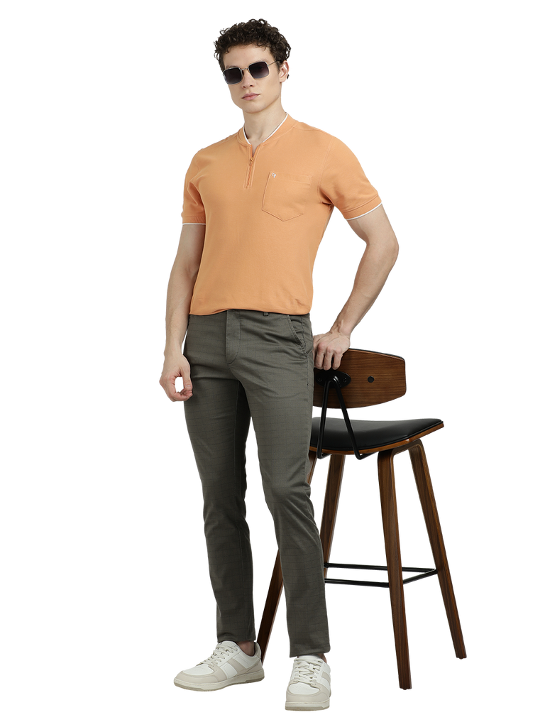 Model wearing Clarke Gable's Dark Olive Custom Fit Trousers in a casual setting