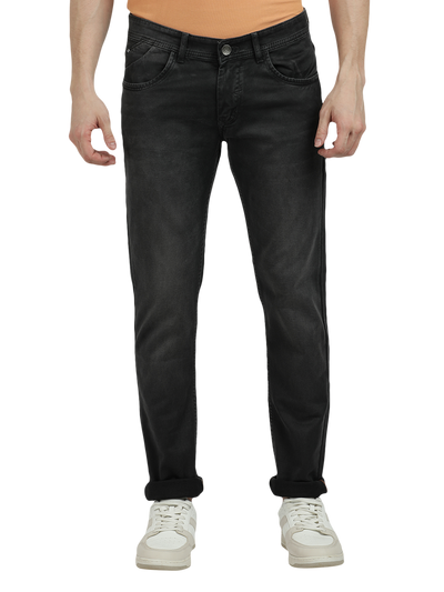 Model wearing Clarke Gable's Dark Olive Tinted Skinny Fit Jeans in a casual setting