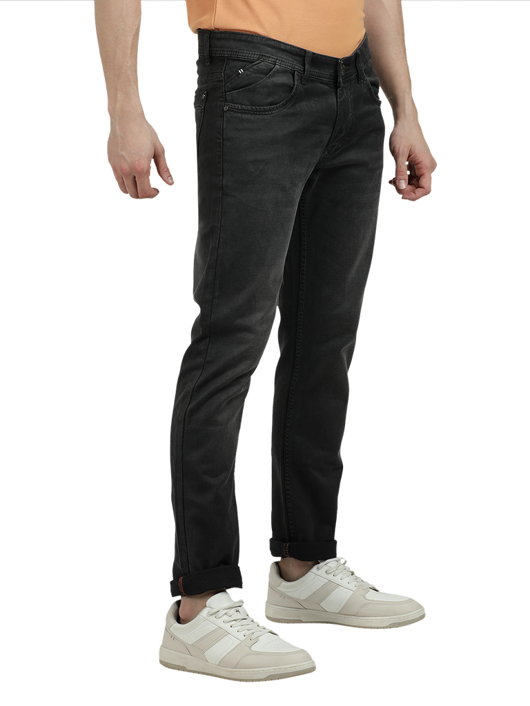 Model wearing Clarke Gable's Dark Olive Tinted Skinny Fit Jeans in a casual setting