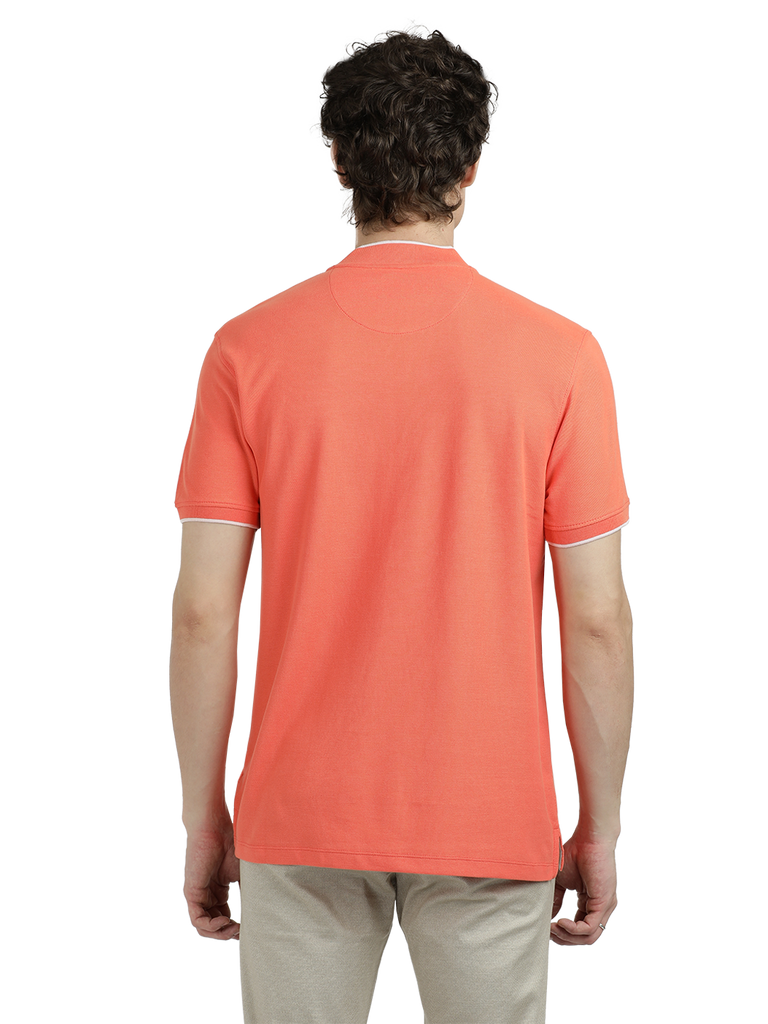 Model wearing Clarke Gable's Dark Orange Solid Henley Neck T-Shirt in a casual setting