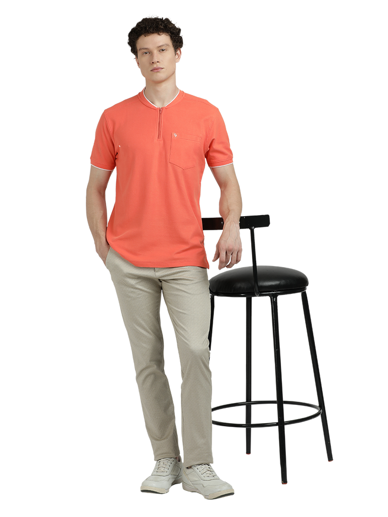 Model wearing Clarke Gable's Dark Orange Solid Henley Neck T-Shirt in a casual setting