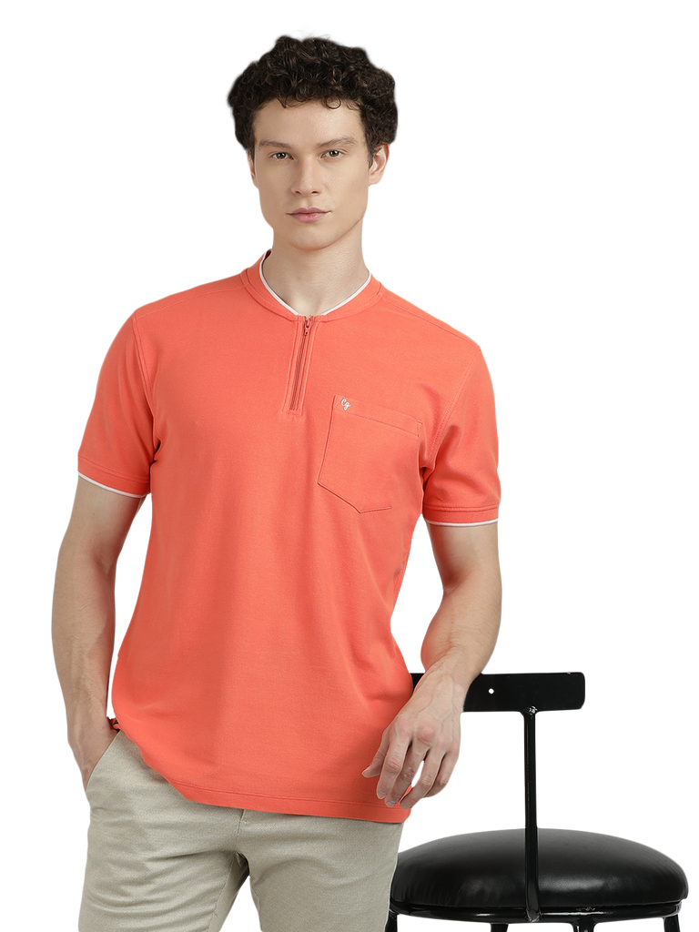 Model wearing Clarke Gable's Dark Orange Solid Henley Neck T-Shirt in a casual setting