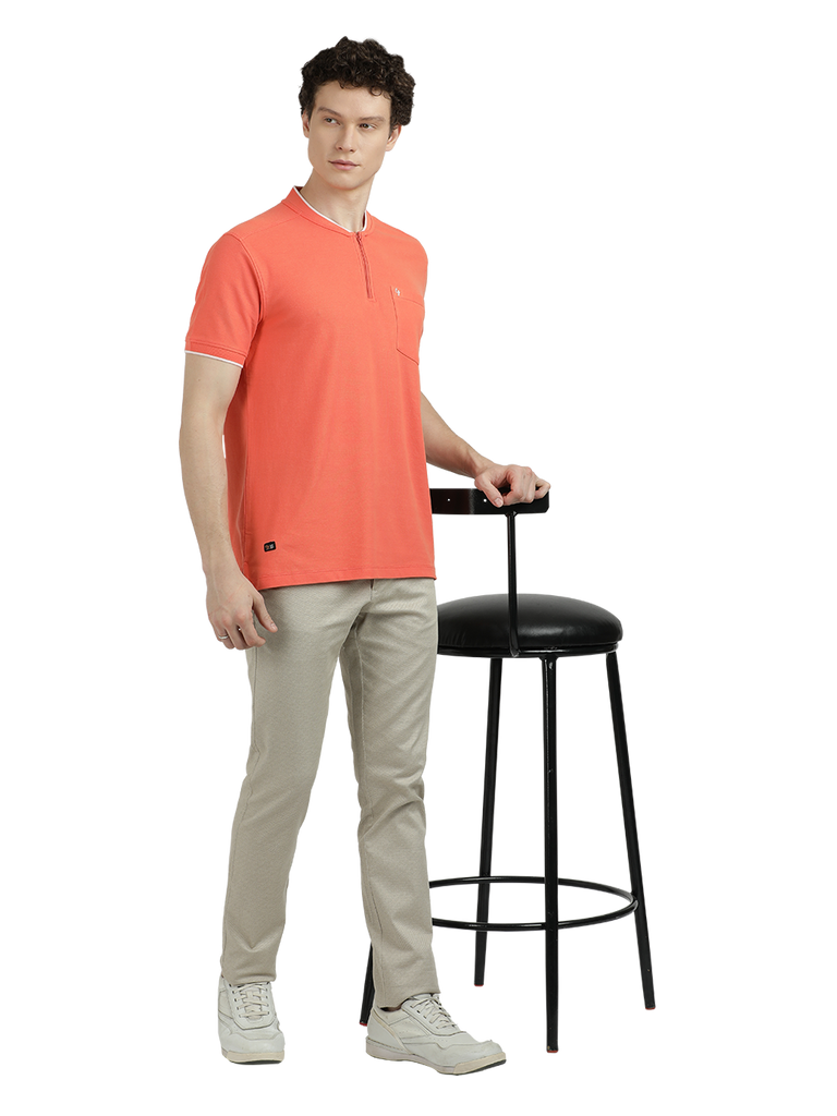 Model wearing Clarke Gable's Dark Orange Solid Henley Neck T-Shirt in a casual setting