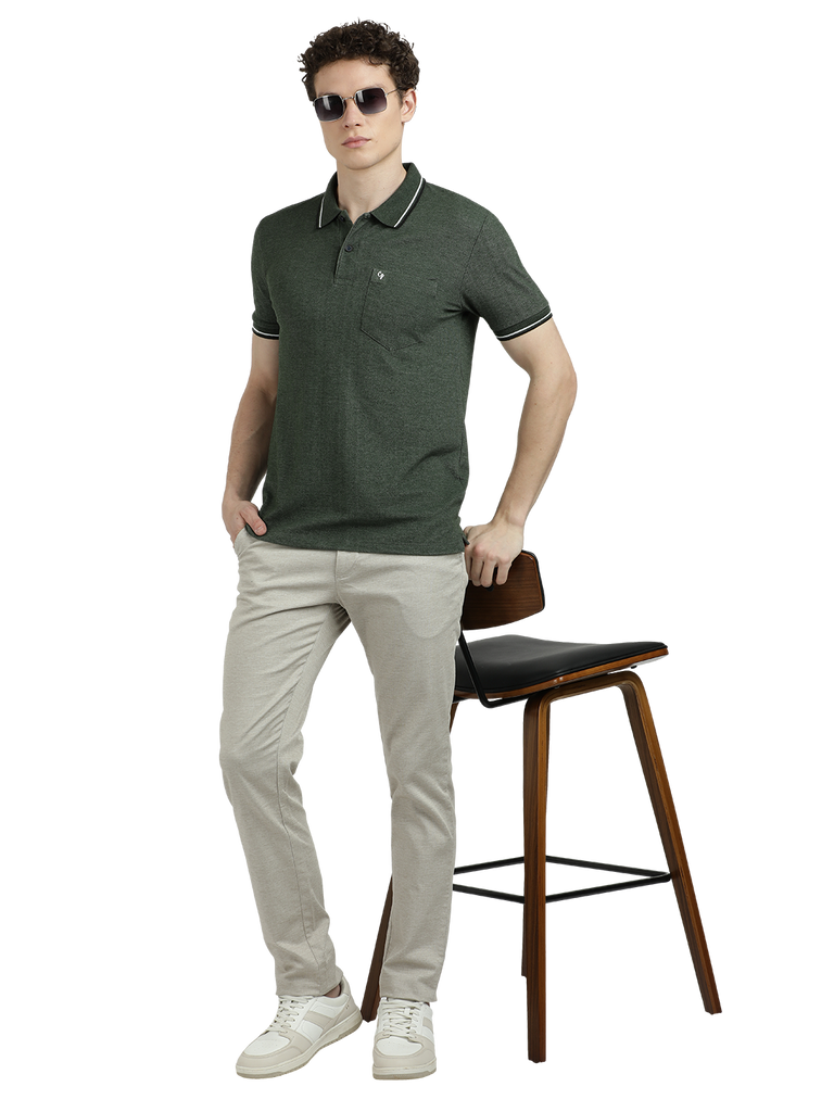 Model wearing Clarke Gable's Green Solid Polo Collar T-Shirt in a casual setting