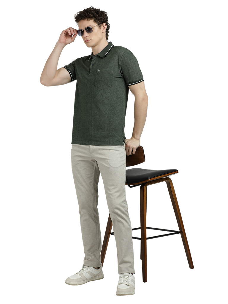 Model wearing Clarke Gable's Green Solid Polo Collar T-Shirt in a casual setting