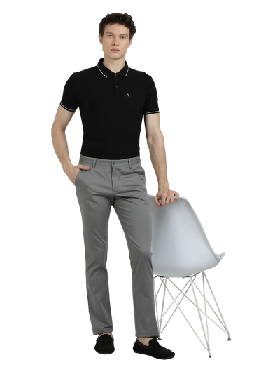 Model wearing Clarke Gable's Grey Custom Fit Trousers in a casual setting