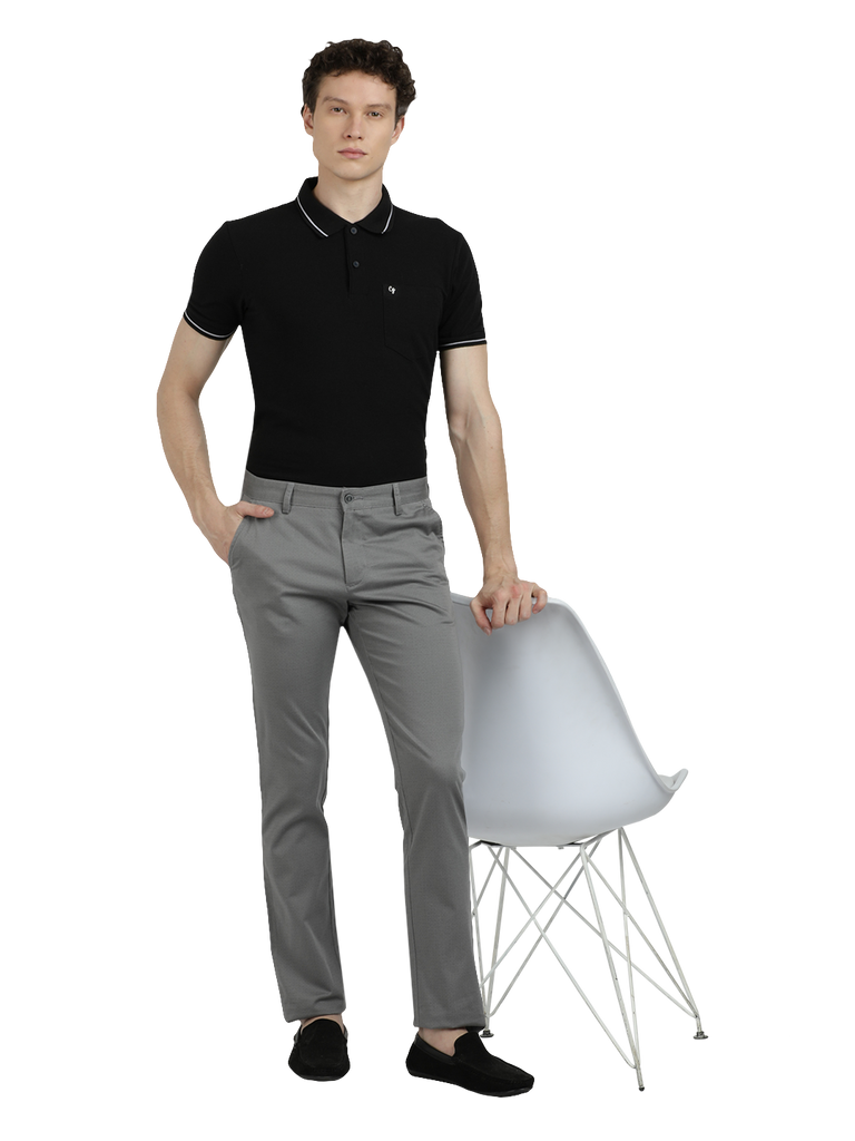 Model wearing Clarke Gable's Grey Custom Fit Trousers in a casual setting