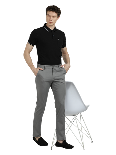 Model wearing Clarke Gable's Grey Custom Fit Trousers in a casual setting