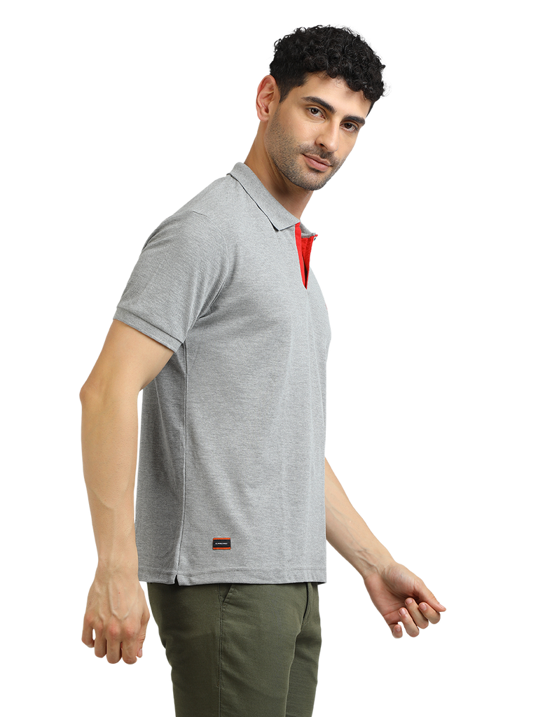 Model wearing Clarke Gable's Grey Melange Solid Polo Collar T-Shirt in a casual setting