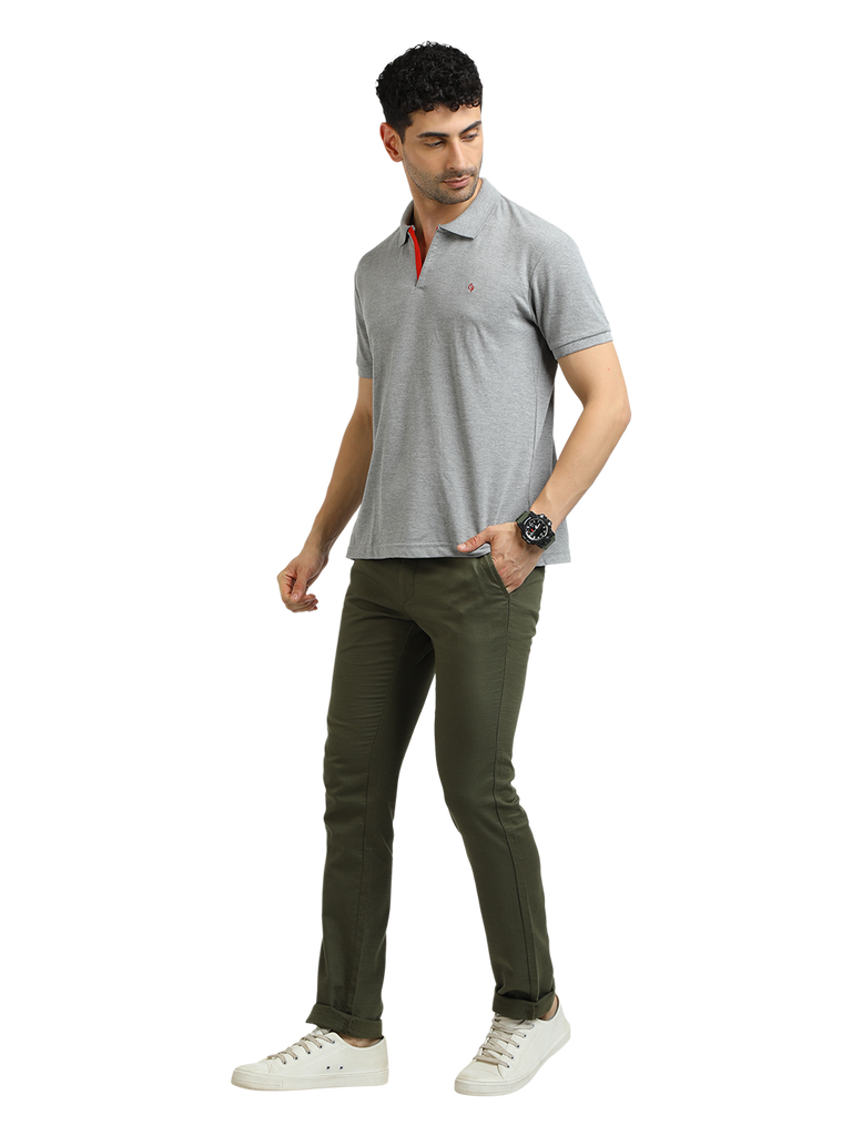 Model wearing Clarke Gable's Grey Melange Solid Polo Collar T-Shirt in a casual setting