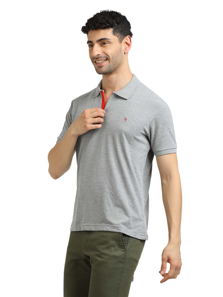 Model wearing Clarke Gable's Grey Melange Solid Polo Collar T-Shirt in a casual setting