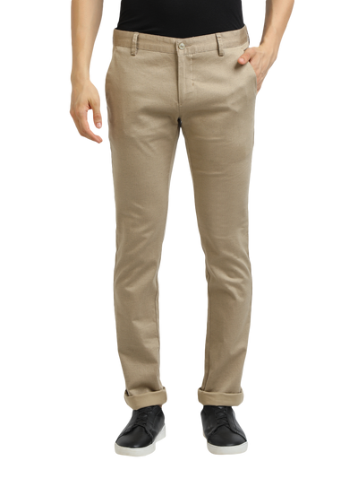 Model wearing Clarke Gable's Khaki Trim Fit Trousers in a casual setting