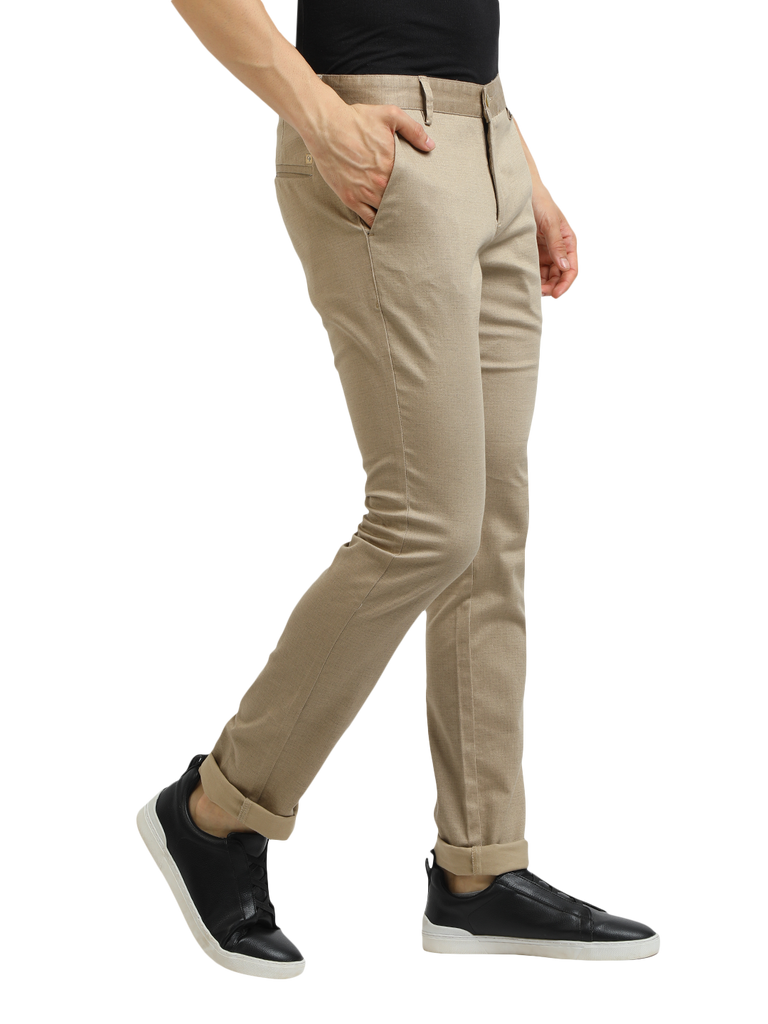 Model wearing Clarke Gable's Khaki Trim Fit Trousers in a casual setting