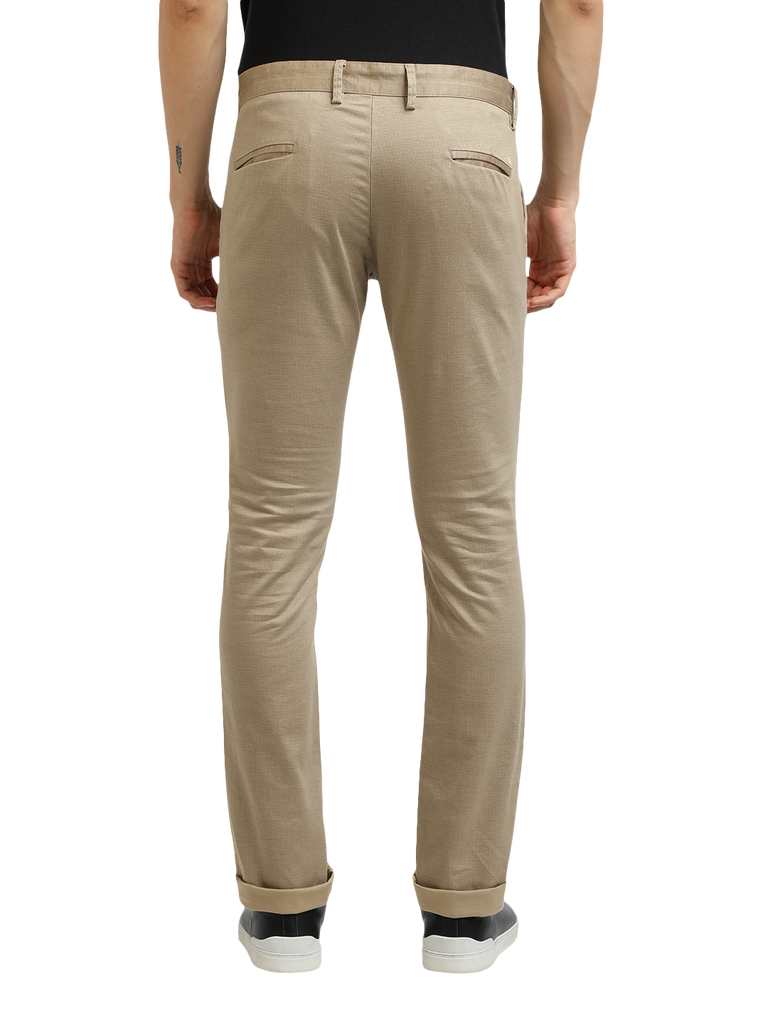 Model wearing Clarke Gable's Khaki Trim Fit Trousers in a casual setting