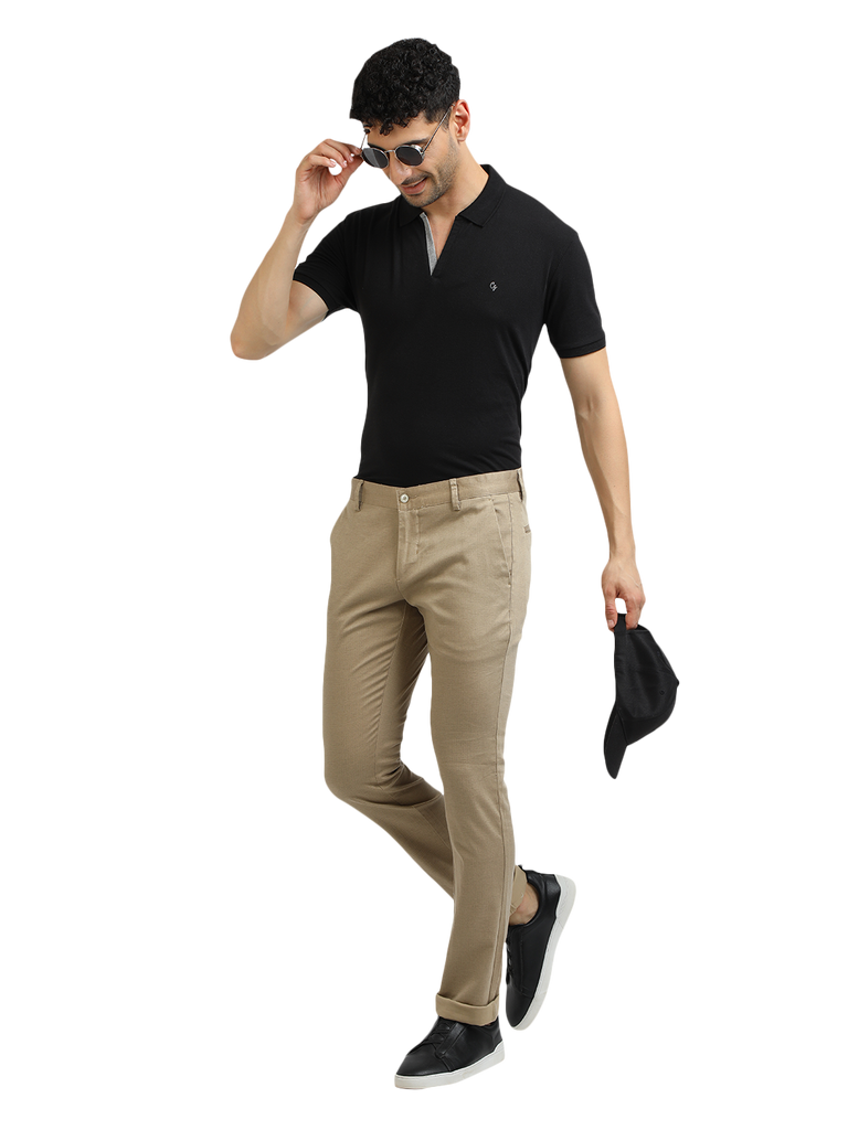 Model wearing Clarke Gable's Khaki Trim Fit Trousers in a casual setting