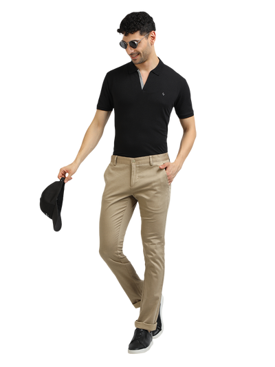 Model wearing Clarke Gable's Khaki Trim Fit Trousers in a casual setting