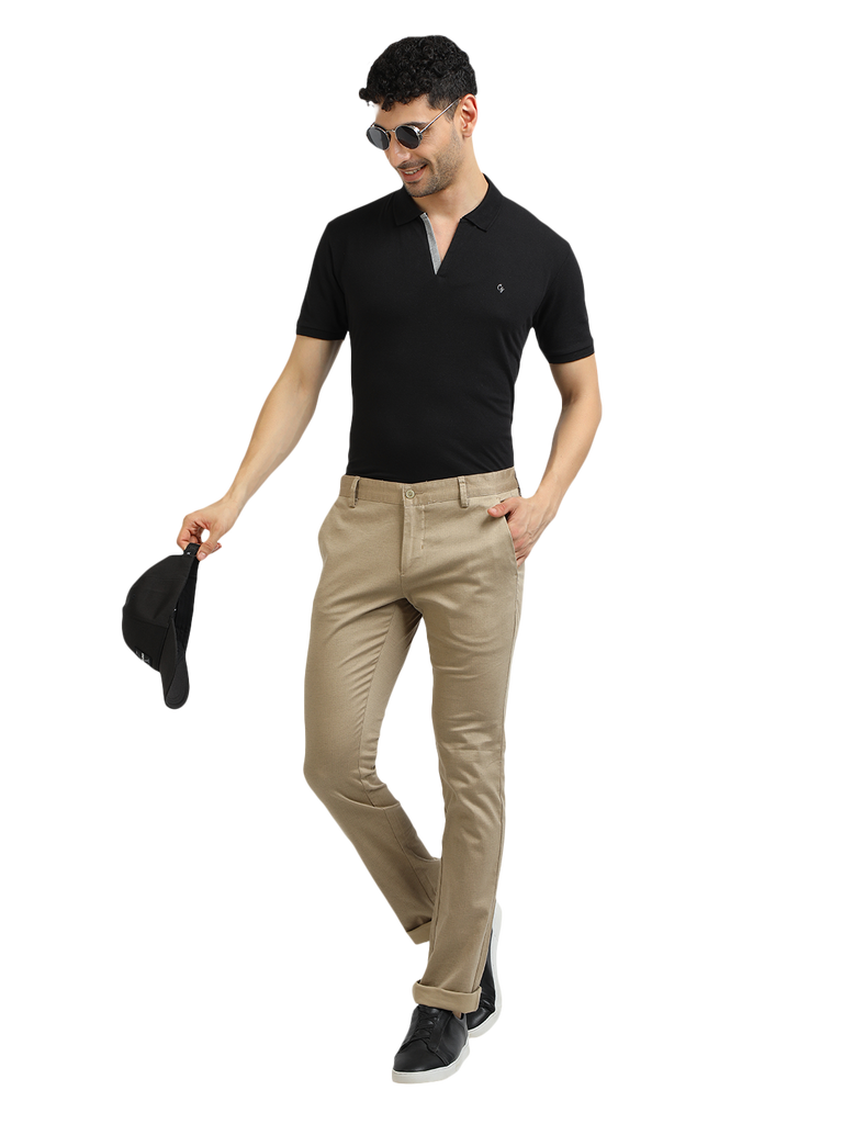 Model wearing Clarke Gable's Khaki Trim Fit Trousers in a casual setting