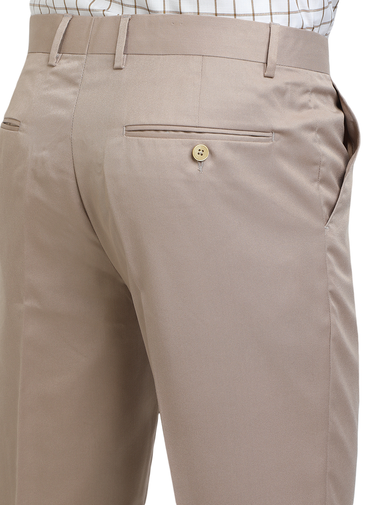 Model wearing Clarke Gable's Light Beige Sharp Fit Trousers in a casual setting