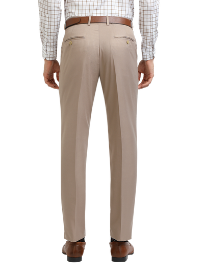 Model wearing Clarke Gable's Light Beige Sharp Fit Trousers in a casual setting