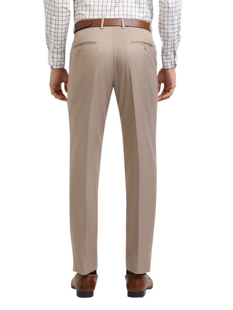 Model wearing Clarke Gable's Light Beige Sharp Fit Trousers in a casual setting