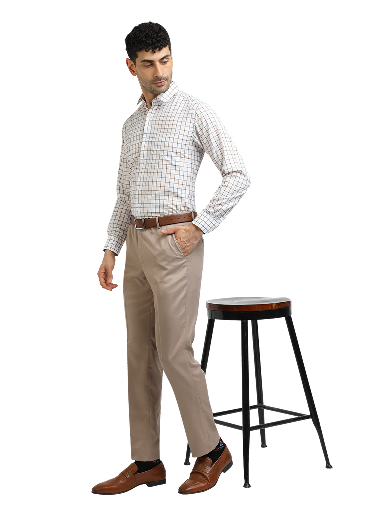 Model wearing Clarke Gable's Light Beige Sharp Fit Trousers in a casual setting