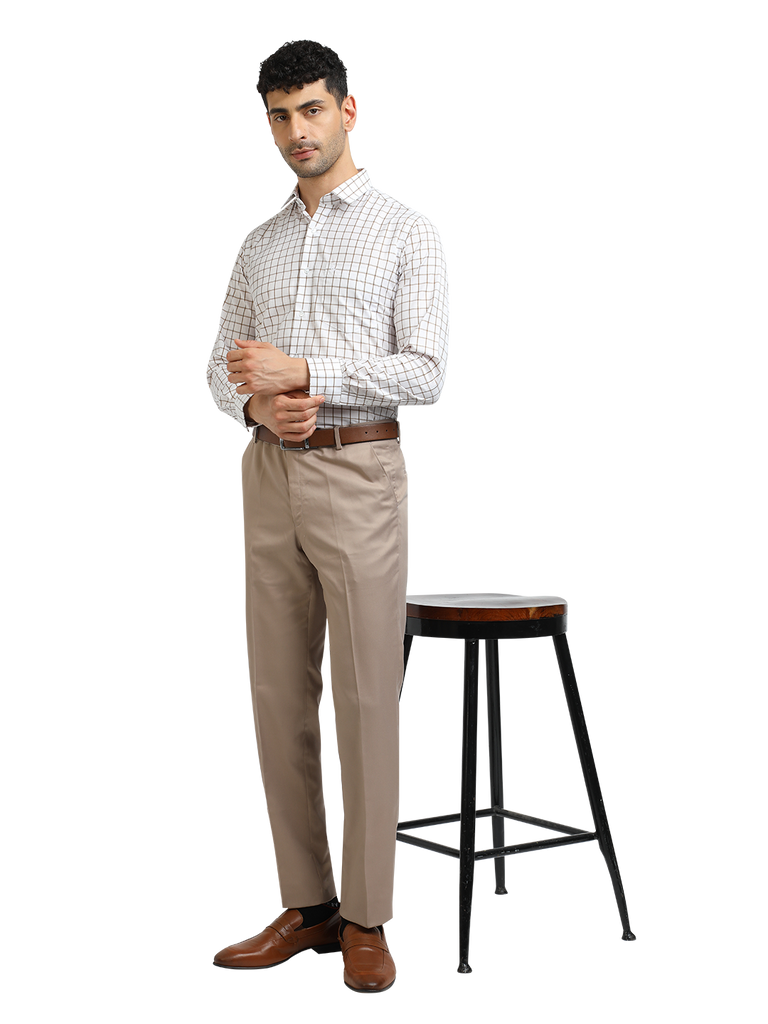 Model wearing Clarke Gable's Light Beige Sharp Fit Trousers in a casual setting