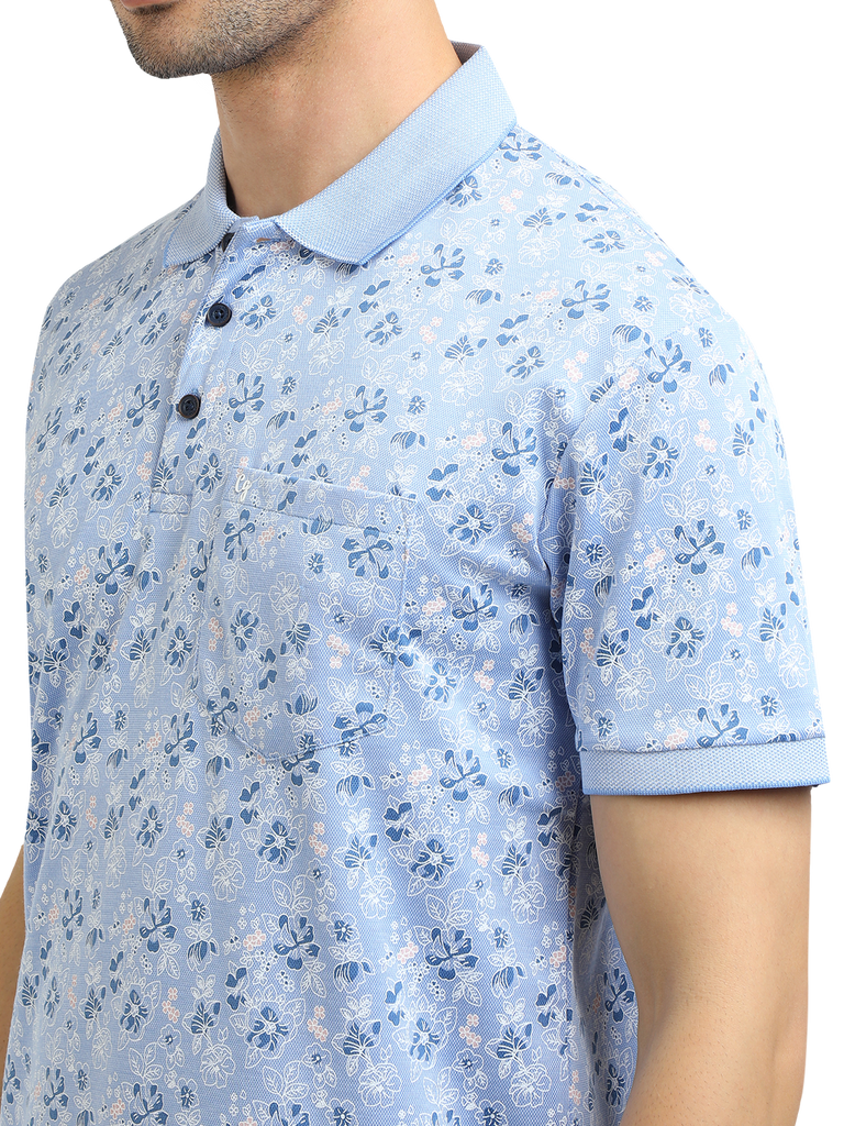 Model wearing Clarke Gable's Light Blue Printed Polo Collar T-Shirt in a casual setting