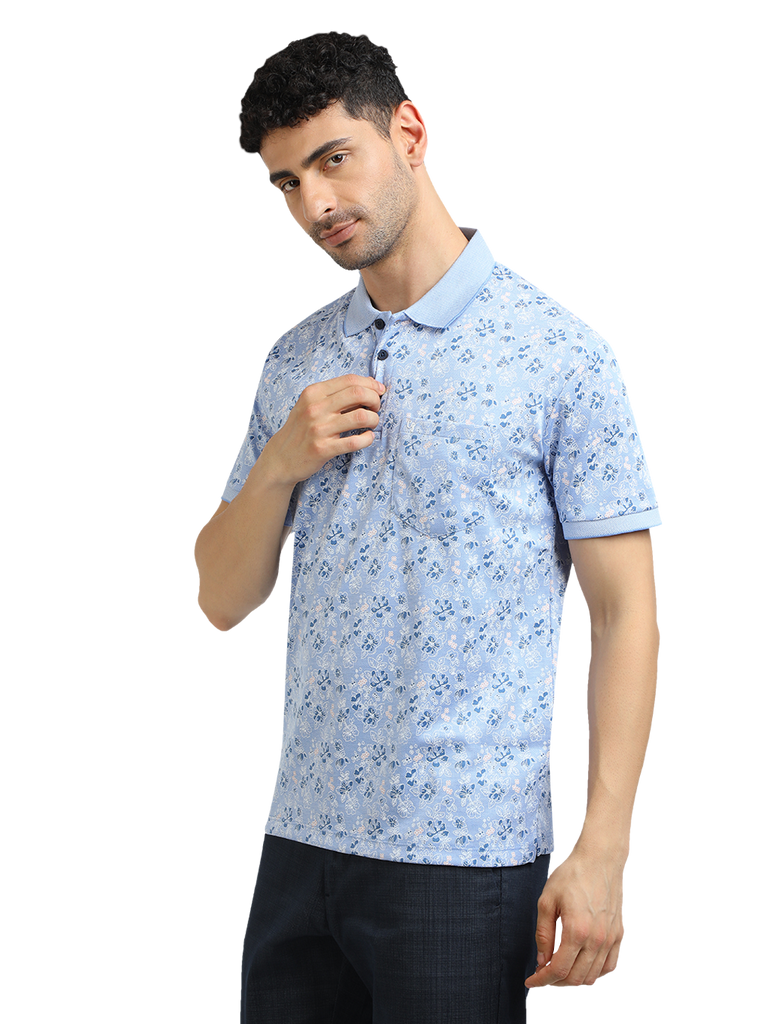 Model wearing Clarke Gable's Light Blue Printed Polo Collar T-Shirt in a casual setting