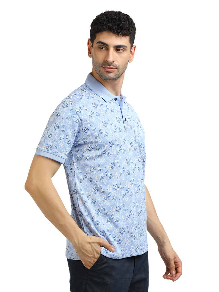 Model wearing Clarke Gable's Light Blue Printed Polo Collar T-Shirt in a casual setting