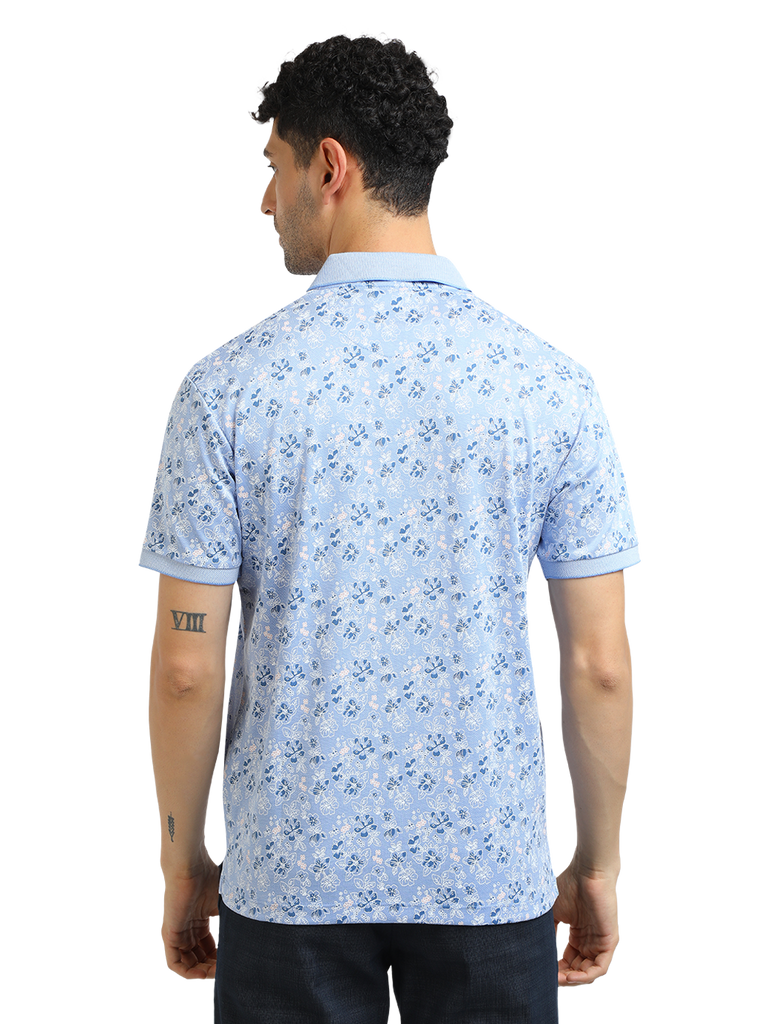 Model wearing Clarke Gable's Light Blue Printed Polo Collar T-Shirt in a casual setting