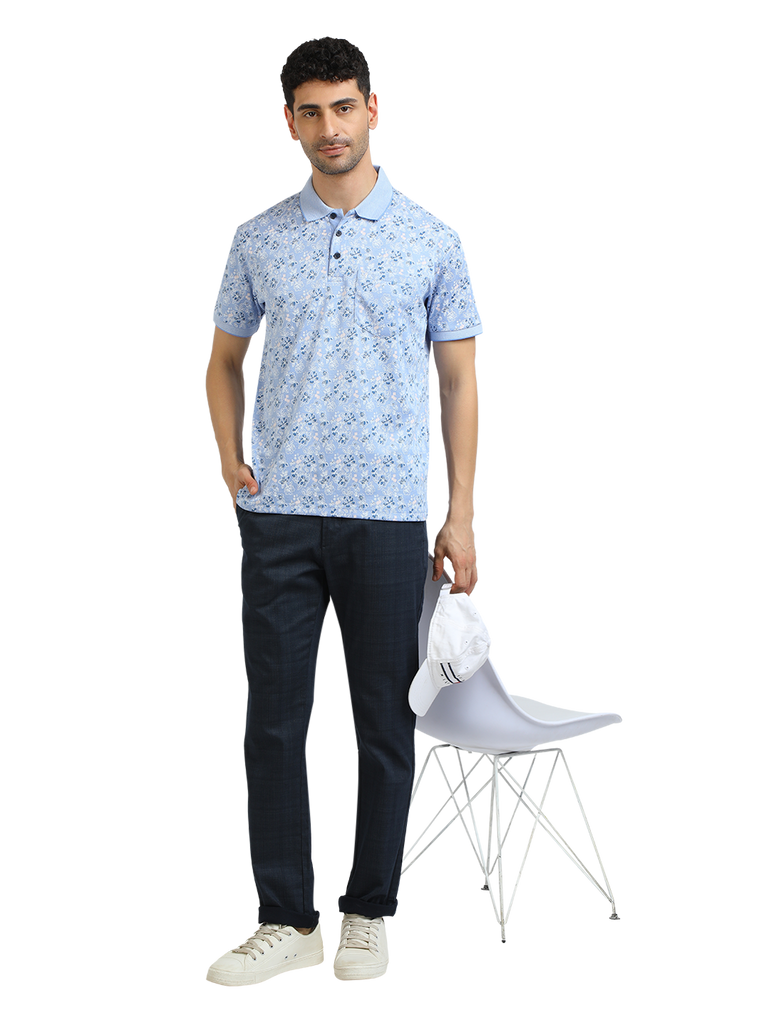 Model wearing Clarke Gable's Light Blue Printed Polo Collar T-Shirt in a casual setting